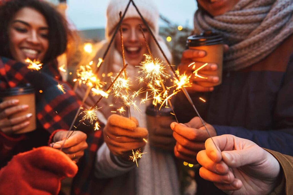 friends having sober holidays with sparklers