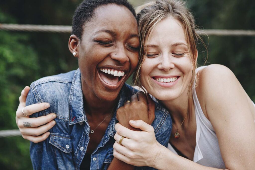 Recovery Support Systems, two women hugging and smiling