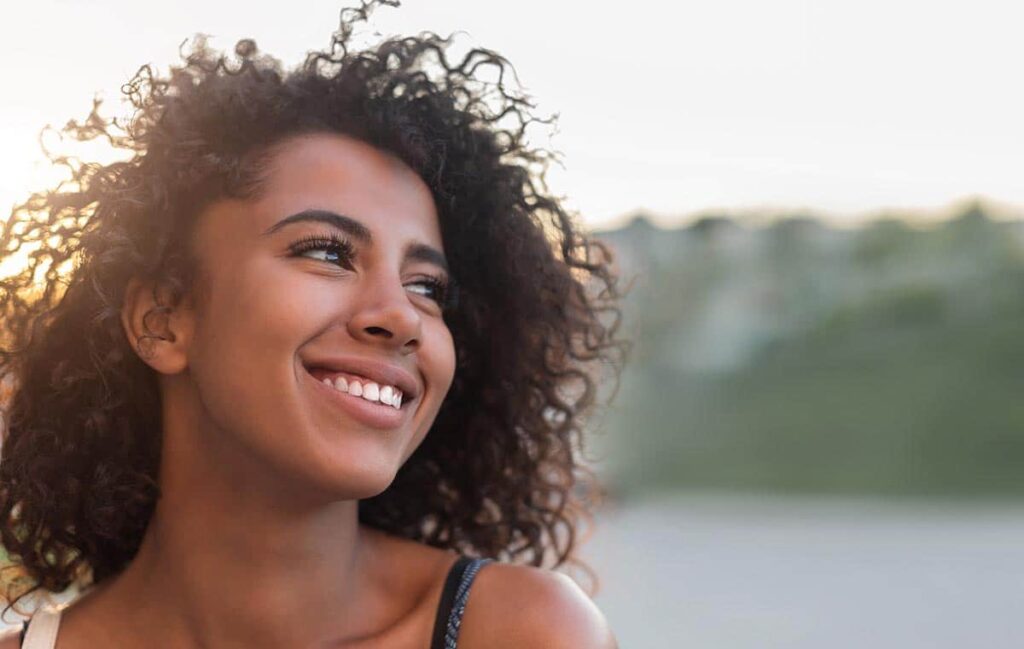 woman smiling as she celebrates national recovery month