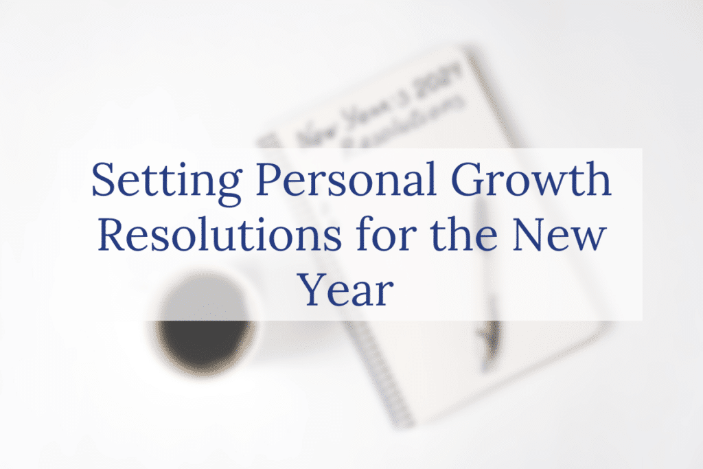 A coffee cup and pen rest on a spiral notebook with blurred text, overlaid with the words Setting Personal Growth Resolutions for the New Year.
